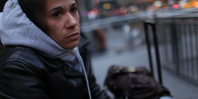 NEW YORK - OCTOBER 26: Ivan Burdos from Puerto Rico sits by her bags while waiting for her husband October 26, 2009 in New York, New York. Burdos and her husband have recently found themselves homeless following a move to New York from Puerto Rico. In a recently released report by the advocacy group Coalition for the Homeless it was revealed that the numbers of homeless people using New York City shelters each night has reached an all time high. Since Mayor Michael Bloomberg took office eight years ago there has been a 45 percent increase in shelter use with over 39,000 homeless people, including 10,000 homeless families, checking in to city shelters every evening. The group also said that 2009 has turned out to be 'the worst on record for New York City homelessness since the Great Depression. (Photo by Spencer Platt/Getty Images) *** Local Caption *** Ivan Burdos