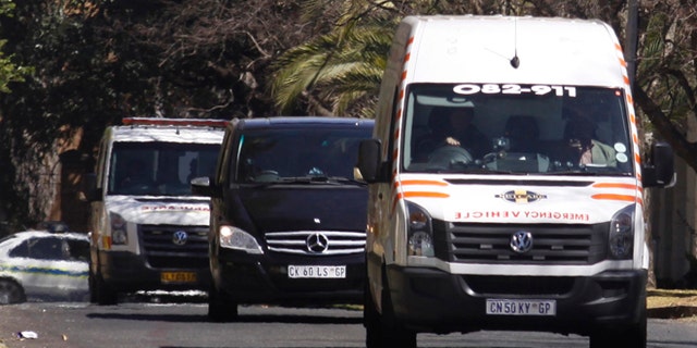 Sept. 1, 2013: An ambulance transporting former South African president Nelson Mandela arrives at the home of the former statesman in Johannesburg, South Africa.
