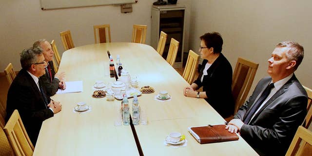 Poland’s President Bronislaw Komorowski, left, his defense adviser Stanislaw Koziej, meeting with Prime Minister Ewa Kopacz, left, and Defense Minister Tomasz Siemoniak, at the National Security Bureau in Warsaw, Poland, Tuesday, April 21, 2015, to discuss a government plan to build Poland’s own missile defense system in cooperation with the U.S. as Poland seeks to enhance its air protection, spurred by the conflict between Russian-backed separatists and government forces in neighboring Ukraine. (AP Photo/Czarek Sokolowski)
