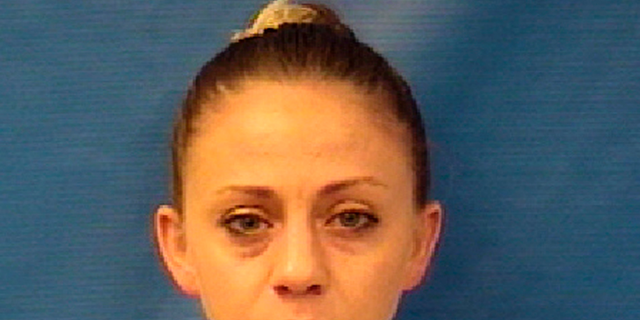 This photo provided by the Kaufman County Sheriff's Office shows Amber Renee Guyger. Guyger, a Dallas police officer, was arrested Sunday, Sept. 9, 2018, on a manslaughter warrant in the shooting of a black man at his home, Texas authorities said. The Texas Department of Public Safety said in a news release that Guyger was booked into the Kaufman County Jail and that the investigation is ongoing. It said no additional information is available at this time. (Kaufman County Sheriff's Office via AP)