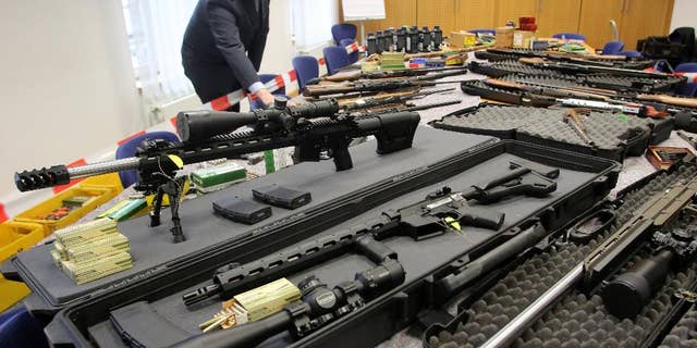 Police display weapons seized already on Nov. 9, 2016 in Solingen , Germany from the radical rightwing 'Reichsbuerger' group, in Wuppertal, Germany, Thursday Nov. 17, 2016. The weapons had previously been in the possession of two members of the anti-government organization. (Roland Weihrauch/dpa vis AP)