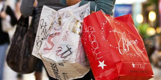 A consumer carries shopping bags in a mall in Charlotte, North Carolina