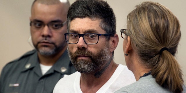 Walter DaSilva, center, of Danbury, Conn., appears in Superior Court for an extradition hearing in Bridgeport, Conn., on Monday, Aug. 8, 2016. DaSilva was arrested in Bridgeport on Friday, and is wanted as a suspect in the July 3 fatal shooting of his 19-year old daughter, Sabrina DaSilva, in New Bedford, Mass. (Ned Gerard/Hearst Connecticut Media via AP, Pool)