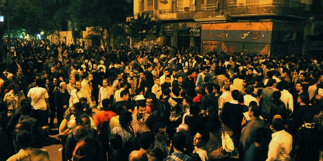 Nov. 19, 2012: Egyptian protesters gather during clashes with security forces, not pictured, in Cairo, Egypt.