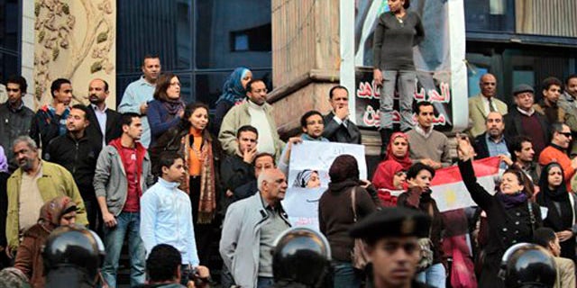 Egyptian anti-government activists chant slogans as they gather outside the Journalists Syndicate in downtown Cairo, Egypt, on Jan. 27.