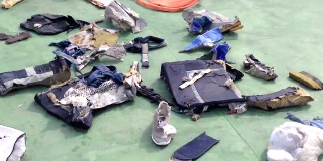 This file still image taken from video posted Saturday, May 21, 2016, on the official Facebook page of the Egyptian Armed Forces spokesman shows some personal belongings and other wreckage from EgyptAir flight 804 in Egypt.
