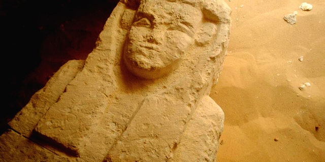 This undated photo released by the Egyptian Ministry of Antiquities shows a sarcophagi in a Ptolemaic tomb in an area known as al-Kamin al-Sahraw, in the Nile Valley province of Minya south of Cairo. Egypt's antiquities ministry says that archaeologists have discovered three tombs dating back more than 2,000 years, from the Ptolemaic Period. (Egyptian Ministry of Antiquities via AP)