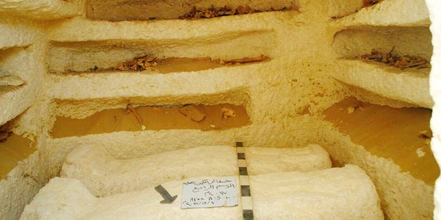 This undated photo released by the Egyptian Ministry of Antiquities shows sarcophagi in a Ptolemaic tomb in an area known as al-Kamin al-Sahraw, in the Nile Valley province of Minya south of Cairo. Egypt's antiquities ministry says that archaeologists have discovered three tombs dating back more than 2,000 years, from the Ptolemaic Period. (Egyptian Ministry of Antiquities via AP)