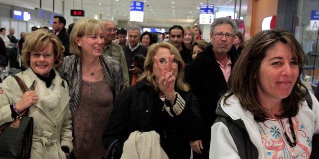 Jan. 31: Tourists from the U.S. arrive at Athens International Airport Eleftherios Venizelos in Spata, near Athens. A tourist group with 65 Americans arrived in Athens as hundreds of foreigners were being evacuated from the unrest in Egypt, with countries scrambling to send planes to fly their citizens out and Cairo's short-staffed international airport a scene of chaos and confusion. (AP)
