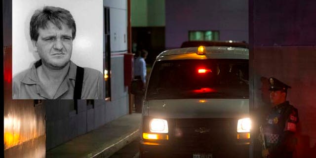A police officer stands guard as a vehicle leaves from the airport hangar of Mexico's Attorney General office, in Mexico City, after the arrival of drug lord Hector "El Guero" Palma, Wednesday, June 15, 2016. Palma, one of the founders of the Sinaloa Cartel, returned to his native country Wednesday after serving almost a decade in a U.S. prison. U.S. authorities handed over Palma in Matamoros, across the border from Brownsville, Texas, before flying him to Mexico City for transfer to Altiplano maximum security prison.(AP Photo/Rebecca Blackwell)