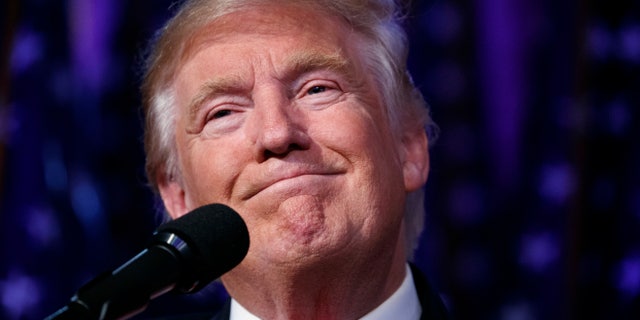 FILE - In this Wednesday, Nov. 9, 2016 file photo, President-elect Donald Trump smiles as he arrives to speak at an election night rally, in New York.