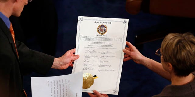 FILE: Jan. 4, 2013: The vote certificate for Maryland presented at a congressional session to certify the electoral college results that deemed President Obama to be president, Washington, D.C.