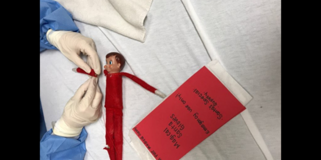 The unidentified surgeon wore "special" gloves so that she could touch the elf during surgery.