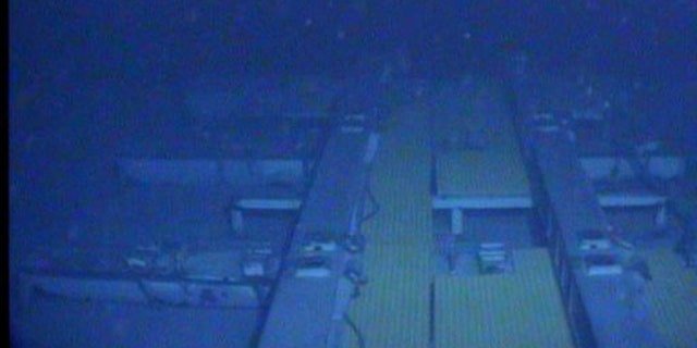 In this photograph released by the National Transportation Safety Board, the damaged stern of the sunken freighter El Faro is seen on the seafloor, 15,000-feet deep near the Bahamas.