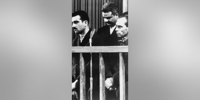 File photo - this picture dated 9 May 1965 shows Israeli spy Eli Cohen (L) and two other unidentified co-defendants, during their trial in Damascus