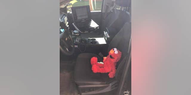 Elmo went out on patrol with the officer before he was placed on a new assignment to watch over the three year old girl.