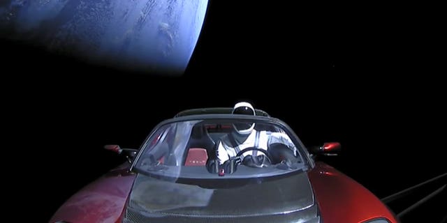 Starman and his Tesla leave Earth behind shortly after launching atop SpaceX's Falcon Heavy rocket on Feb. 6, 2018.