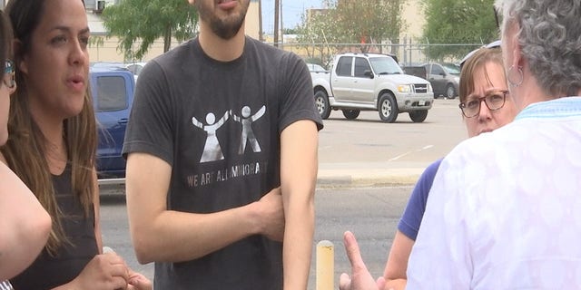 Gomez wore a shirt reading, "We are all immigrants," while helping the group unload donated items.