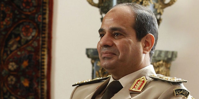 Egypt's Army Chief General Abdel Fattah al-Sisi attends a meeting with Egypt's interim President Adly Mansour, Russia's Defence Minister Sergei Shoigu and Foreign Minister Sergei Lavrov (not pictured) at El-Thadiya presidential palace in Cairo, November 14, 2013. REUTERS/Amr Abdallah Dalsh