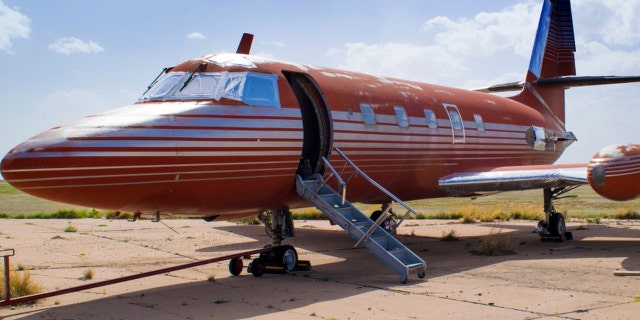 This undated file photo provided by GWS Auctions, Inc. shows a private jet once owned by Elvis Presley, on a runway in New Mexico.