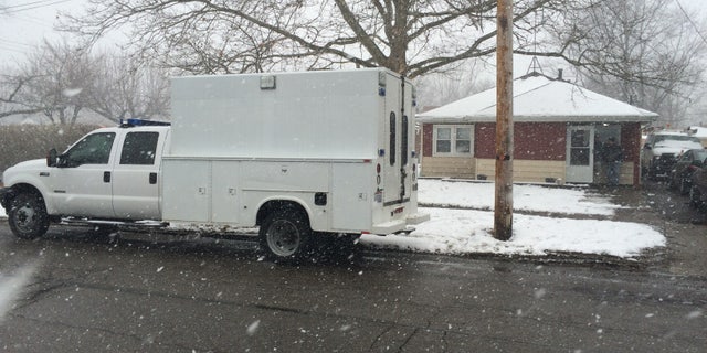 Investigators at the home in Elyria.