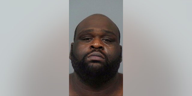 Emanjula Daracus Brown was arrested after allegedly whipping out a gun over a dispute at Burger King.