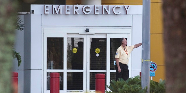 FILE: December 8, 2009: A man stands outside the emergency room of Health Central Hospital, in Occoee, Florida.