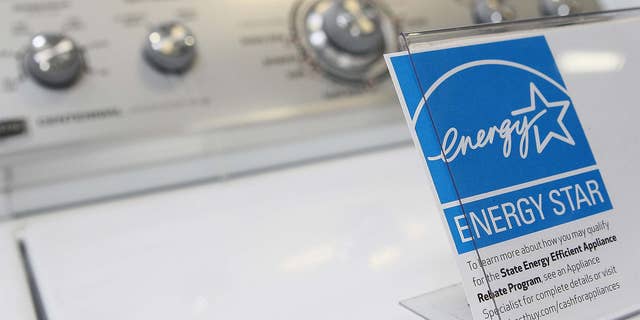 A washing machine rated as energy efficient is pictured.