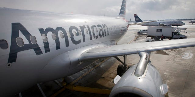 An Illinois dentist says he was booted from a regional American Airlines flight for being overweight.