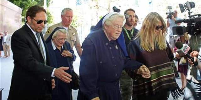 Sister Catherine Rose Holzman, second from left, among a group leaving Los Angeles Superior Court in July 2015. The nuns have been battling with Katy Perry.
