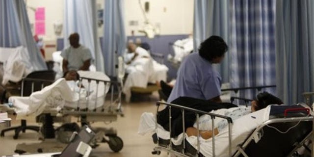 Patients are cared for at the emergency room at Jamaica Hospital in New York March 22. (AP Photo)