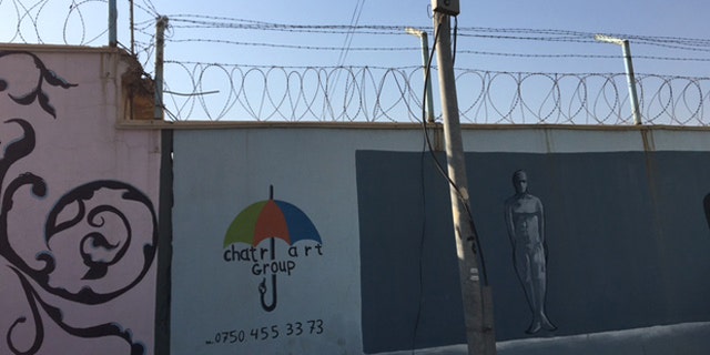 The graffiti-speckled cement exterior walls of the Women and Children's Prison of Erbil. (Photo: Hollie McKay/FoxNews.com)