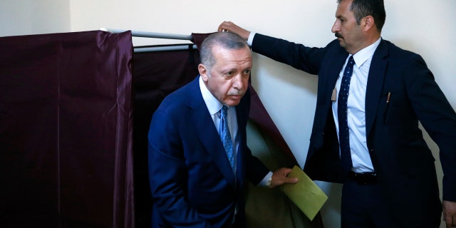 Turkey's President Recep Tayyip Erdogan cast his ballot in Istanbul Sunday.