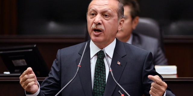June 25, 2013: Turkish Prime Minister Recep Tayyip Erdogan addresses his supporters and lawmakers at the parliament in Ankara, Turkey.