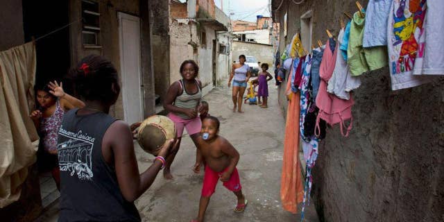 Children play in Favela do Metro shantytown in Rio de Janeiro, Brazil.