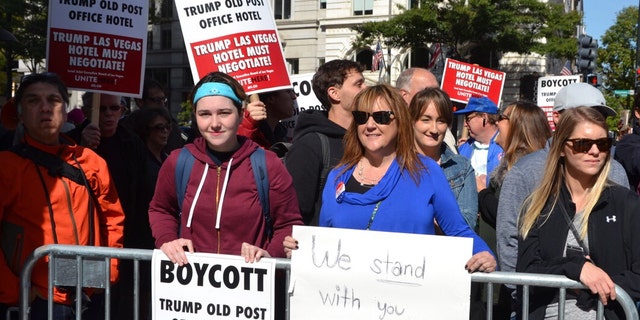 Protesters on both sides of the aisle greeted the Trumps outside the property.