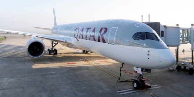 An Airbus A350 XWB is pictured on the tarmac during the first delivery of this new passenger jet at Qatar Airways in Toulouse, southwestern France, December 22, 2014. European planemaker Airbus delivered its first A350 mid-sized jetliner to Qatar Airways on Monday and moved to end speculation about the future of its larger A380 superjumbo. REUTERS/Regis Duvignau (FRANCE - Tags: TRANSPORT BUSINESS) - RTR4IYZ2