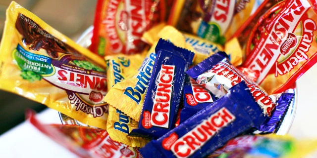 Nestle says its new candy will be just as sweet-- with much less sugar.
