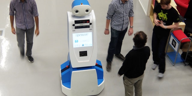 Spencer the robot helps airline passengers navigate through busy terminals.