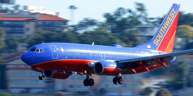 A Southwest Airlines jet comes in to land at Lindbergh Field in San Diego, California February 25, 2015. Southwest Airlines Co said it pulled 128 aircraft out of service on Tuesday after it discovered that they were overdue for a required check of the standby hydraulic system that serves as a backup to the planes' primary systems.  REUTERS/Mike Blake (UNITED STATES - Tags: TRANSPORT BUSINESS) - RTR4R5QH
