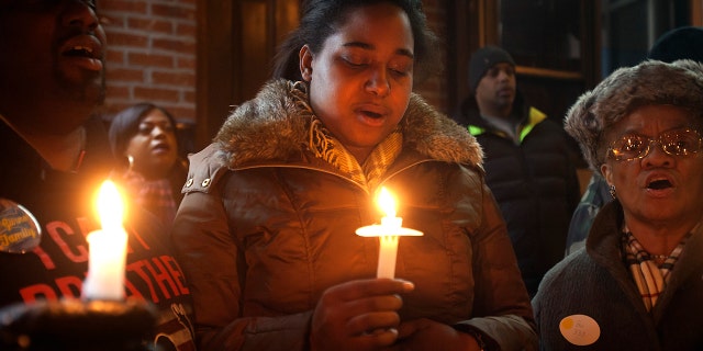 Erica Garner — whose father Eric Garner became a symbol of police brutality when he died after being placed in a chokehold — was in a coma Sunday night after suffering a heart attack, family members said.