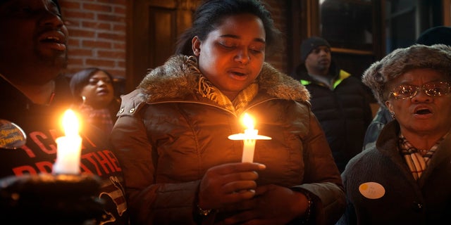 Erica Garner, pictured here in January 2015, has been in a medically induced coma since Saturday, after suffering a heart attack.