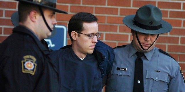 Eric Frein with Pennsylvania state troopers in 2015.