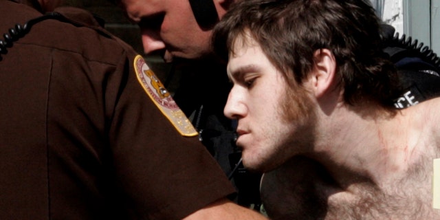 FILE: William Morva, is escorted out of the Montgomery County magistrates office after his capture in Christiansburg, Va.