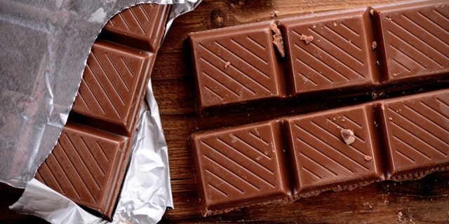 the chocolate bar on the wooden table