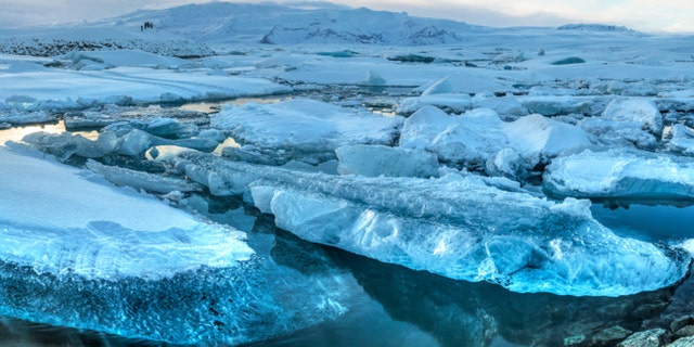 Panoramic view of icebergs in Jokulsarlon glacial lagoon and Breidamerkurjokull glacier on a sunny winter's afternoon in Iceland (HDR)