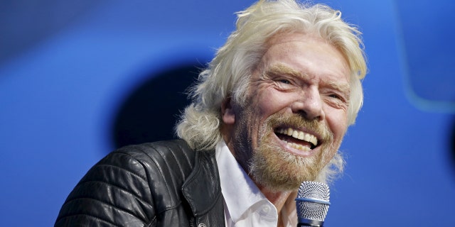 Richard Branson unveils the new SpaceShipTwo, a six-passenger two-pilot vehicle meant to ferry people into space that replaces a rocket destroyed during a test flight in October 2014, in Mojave, California, United States, February 19, 2016. REUTERS/Lucy Nicholson - RTX27RNX