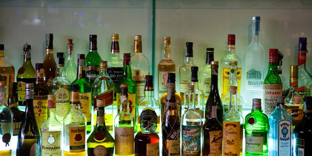 Pozzuoli, Italy - December 26, 2012: Group of bottles at the back of a bar in Pozzuoli, Bay of Naples, Italy. Vodka, Scotch, malt whisky, Irish Whisky, Bourbon and other drinks.