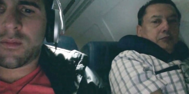 Busted. Clever flyer finds a way to catch a snooping seatmate.