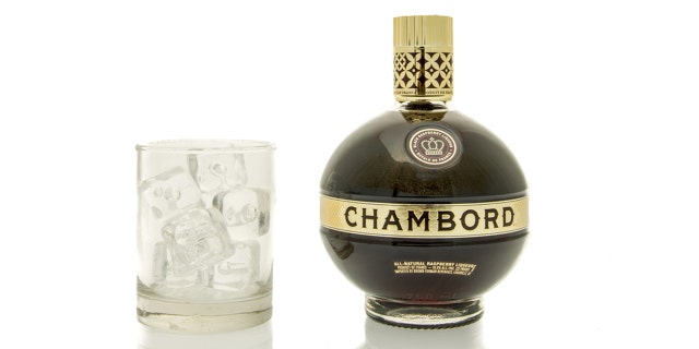 Winneconne, WI, USA - 15 March 2016: A bottle of Chambord Liqueur with a glass of ice.